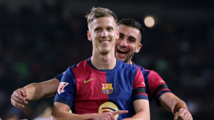 Barca cruise past Osasuna to bolster Liga title bid