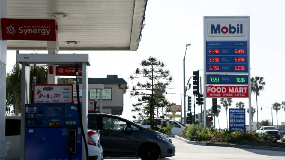 US revises first quarter growth down while inflation climbs