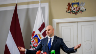 Opposition Latvian lawmaker tapped to form interim government